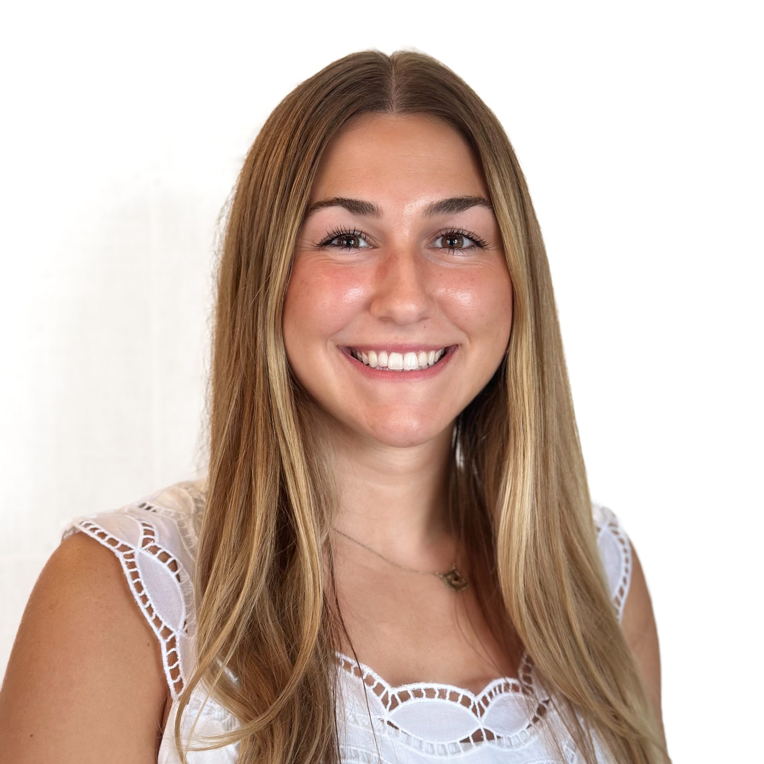 Headshot Brielle Psychotherapy Neurofeedback Intern brown hair, blue eyes, glasses, flower top smiling